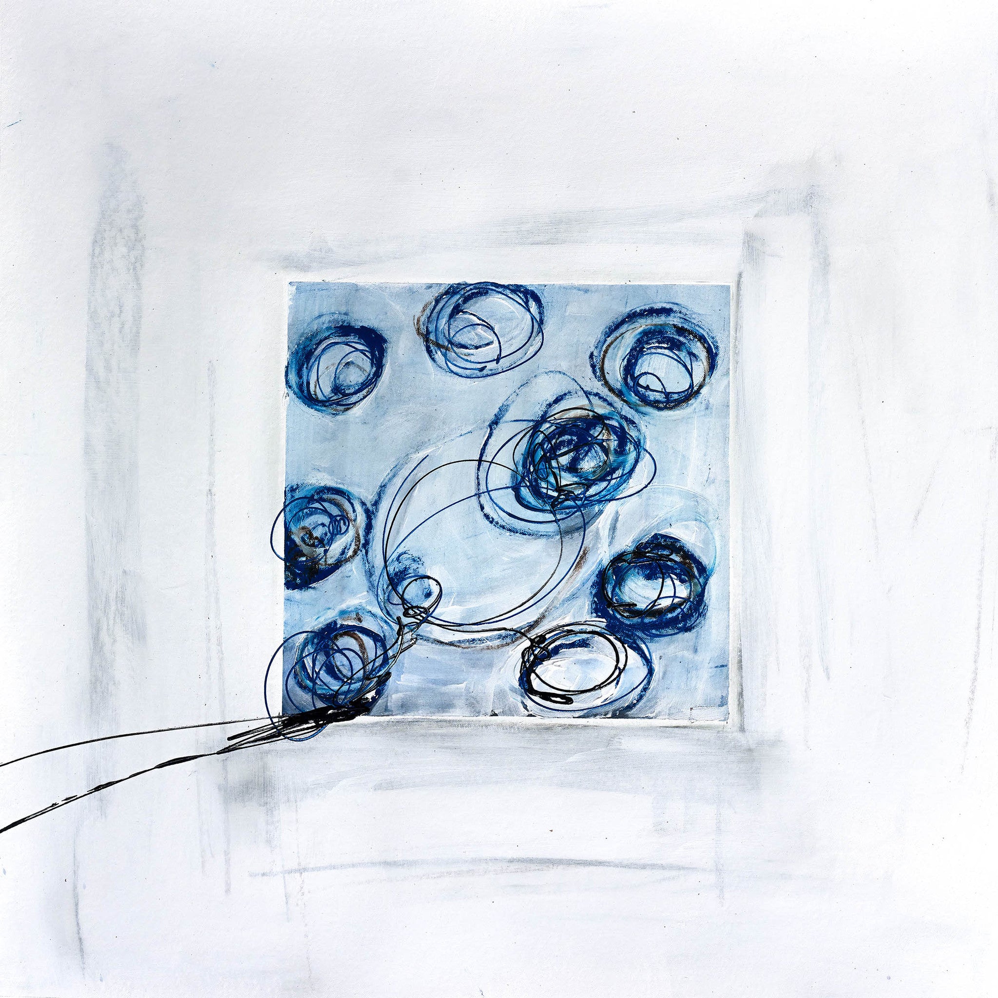 Playful modern art with expressive blue, grey, and black circular shapes on a white background, dynamic and contemporary.